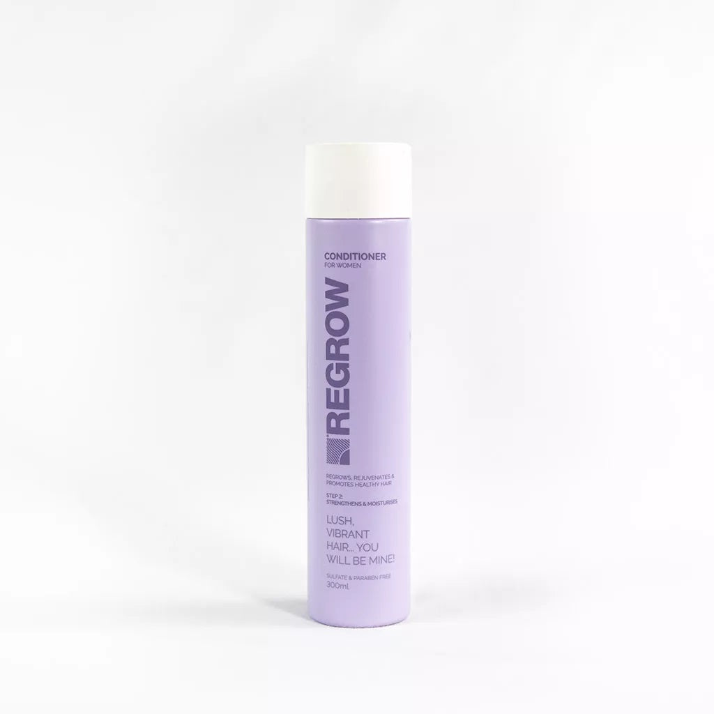 Purple bottle of Regrow conditioner on a white background