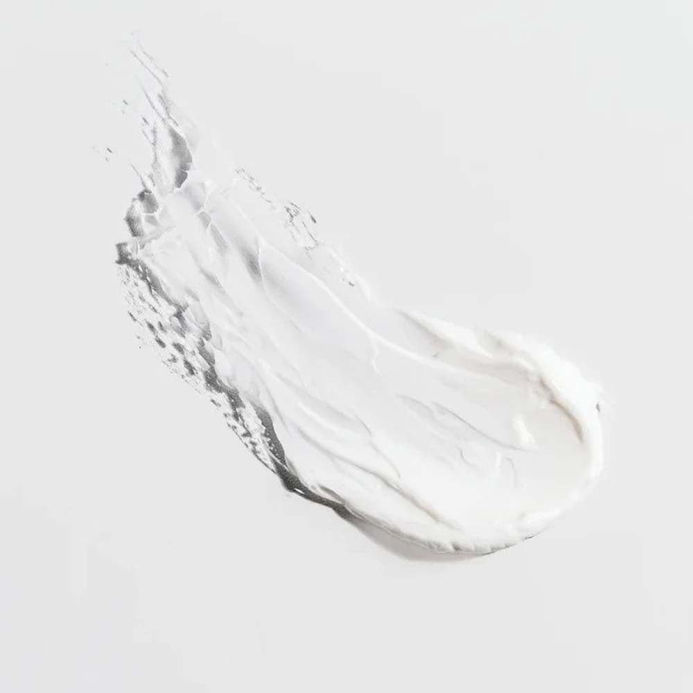 Clear gel or cream swatch on a light gray background