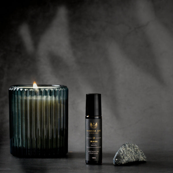 Inara natural botanical perfume oil roller with candle moody fragrance scene – Ananda Life