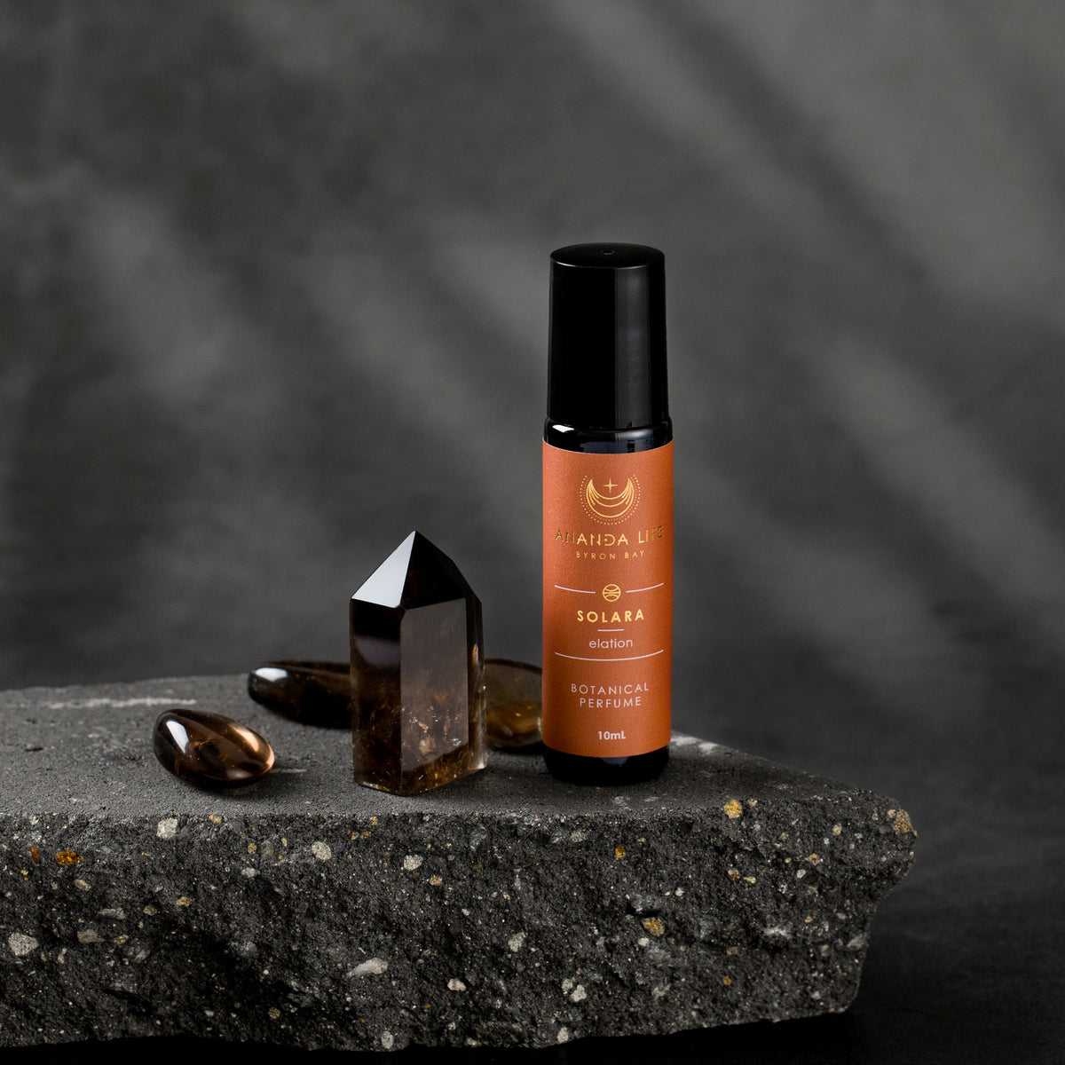 Solara botanical perfume oil roller with crystal styled fragrance scene