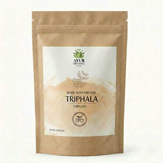 Kraft paper packaging of Ayur Organic Triphala capsules on a white background