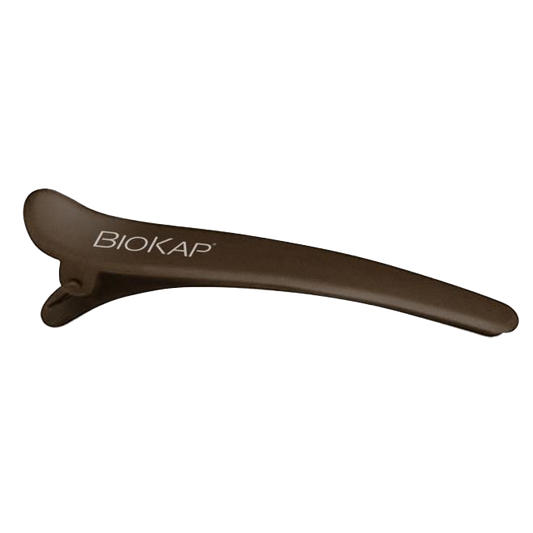 Brown hair clip with 'BIOKAP' branding on a white background