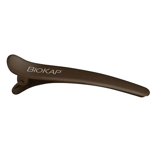 Brown hair clip with 'BIOKAP' branding on a white background