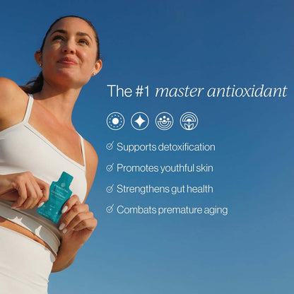 Woman holding a product with text about antioxidants against a blue sky