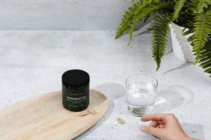 Cymbiotika Probiotic Capsules with a glass of water