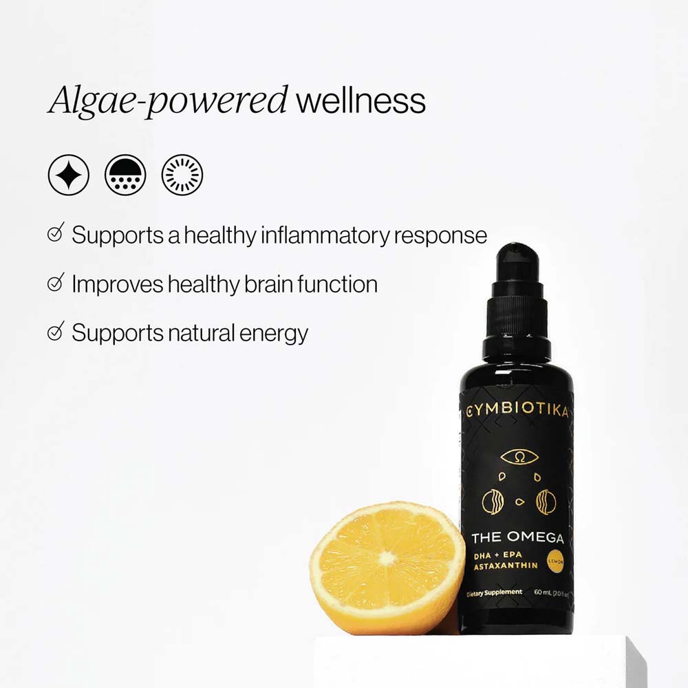 Supplement bottle with lemon slice on a white background, featuring 'Cymbiotika' brand.