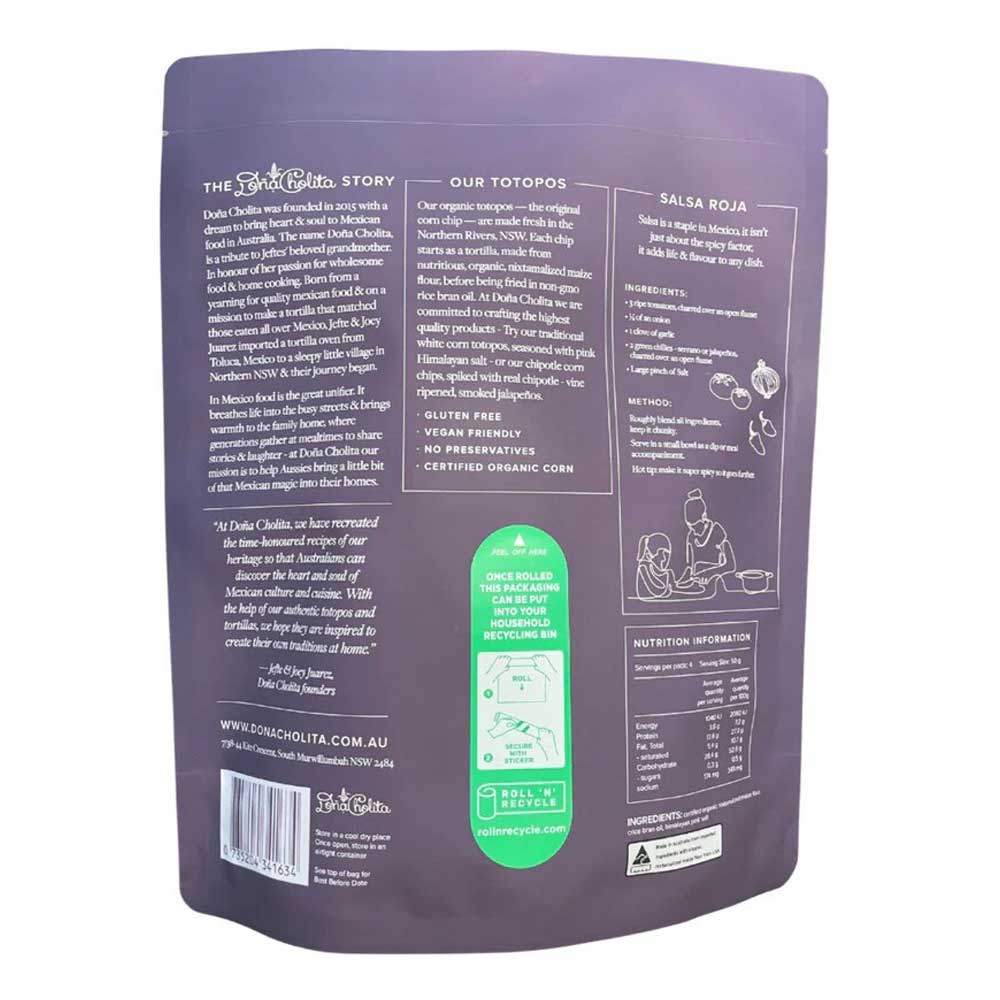 Back view of a purple dona cholita blue corn totopos package with text and branding on a white background