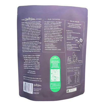 Back view of a purple dona cholita blue corn totopos package with text and branding on a white background