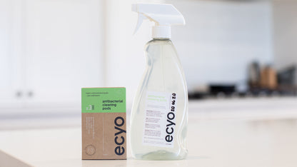 Eco-friendly cleaning product with packaging on a kitchen counter