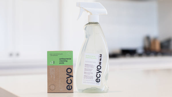 Eco-friendly cleaning product with packaging on a kitchen counter