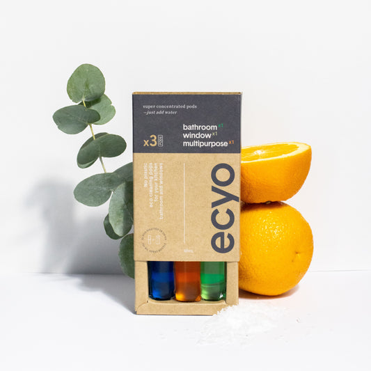 ecyo bathroom, window and multipurpose cleaning pods product packaging with lemons and eucalyptus on a white background