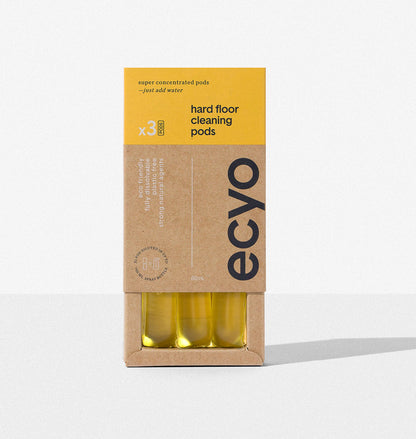 Box of eco-friendly hard floor cleaning pods with yellow and brown packaging on a white background