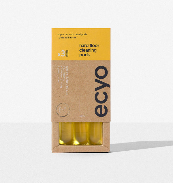 Box of eco-friendly hard floor cleaning pods with yellow and brown packaging on a white background