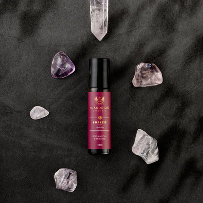 Empress botanical perfume oil roller with crystals styled fragrance scene