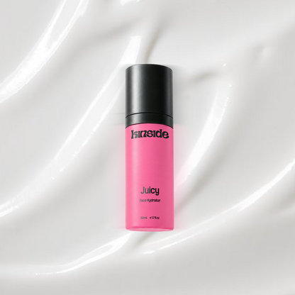 Juicy Face Hydrator bottle on a coloured background