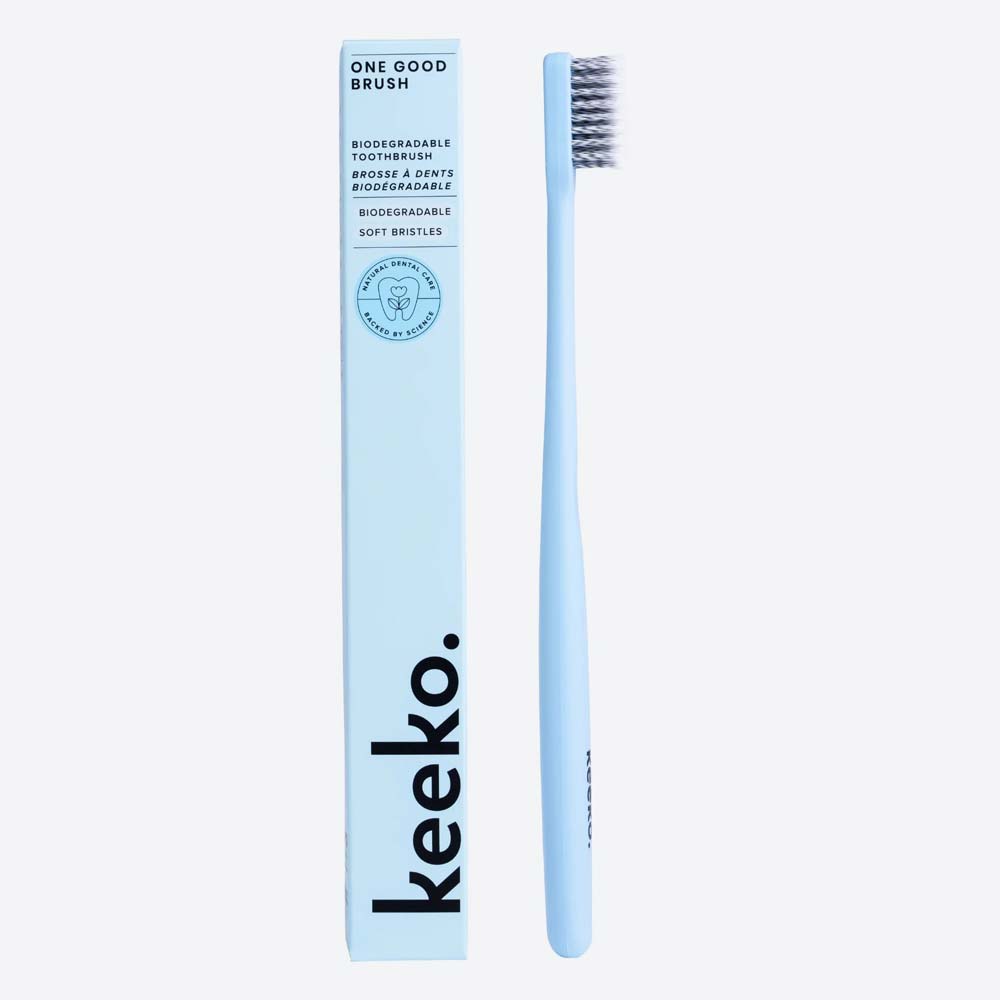 Keeko bio toothbrush and packaging in blue on a white background