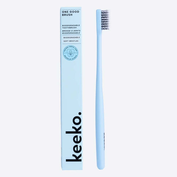 Keeko bio toothbrush and packaging in blue on a white background