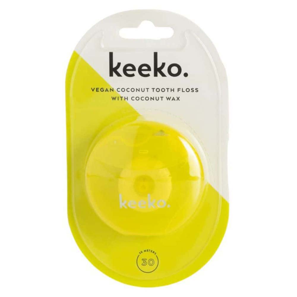 Yellow coconut tooth floss container with 'keeko' branding on a white background