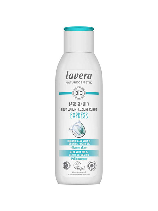 A white bottle of Lavera Basis Sensitiv Body Lotion Express 250ml for normal or sensitive skin, featuring organic aloe vera and jojoba oil on the label and a blue water splash graphic on the front.