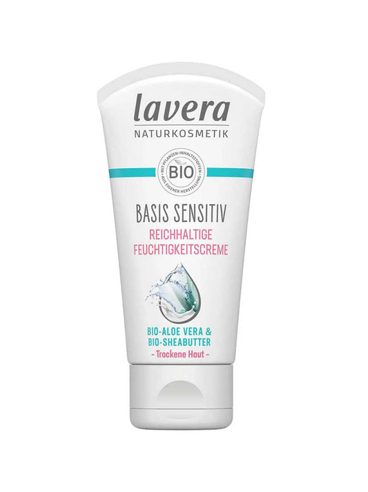 A white tube of Lavera Basis Sensitiv Regenerating Moisturising Cream 50ml for sensitive skin, with organic aloe vera and Bio-Shea Butter, features blue and pink text plus a water splash graphic on the front.