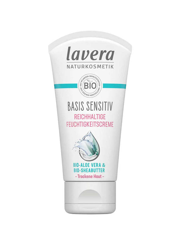 A white tube of Lavera Basis Sensitiv Regenerating Moisturising Cream 50ml for sensitive skin, with organic aloe vera and Bio-Shea Butter, features blue and pink text plus a water splash graphic on the front.