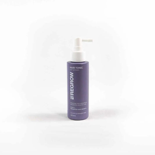 Purple bottle of Regrow hair tonic on a white background