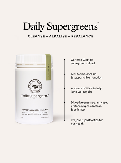 Daily Supergreens supplement bottle with product benefits on a white background