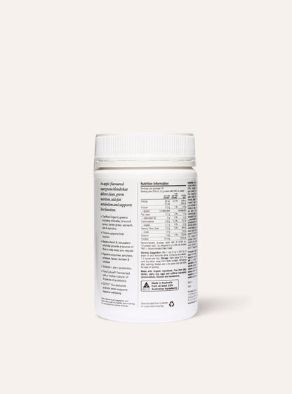 White supplement container of daily supergreens with label on a white background