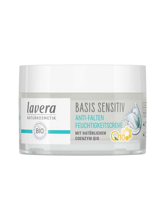 Low clear jar of Lavera Basis Sensitiv Q10 Moisturising Day Cream with a wide white lid, turquoise label accents, a yellow Q10 mark and blue water droplets.