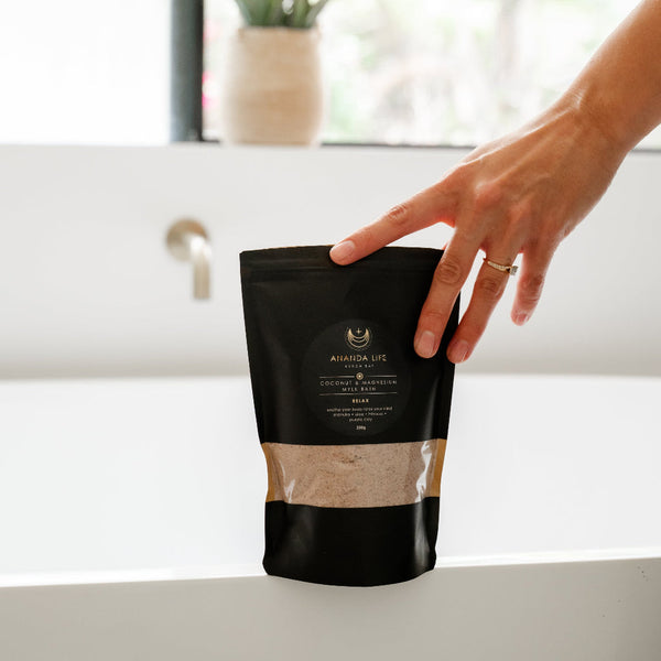 Relax coconut magnesium bath soak pouch beside bath calming mineral bath salts